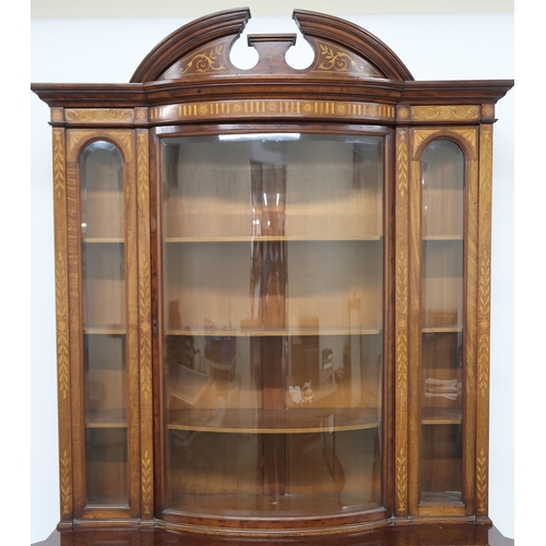 2023 - A LATE VICTORIAN WALNUT AND SATINWOOD INLAID DISPLAY CABINET with shaped cornice over bow front glaz... 