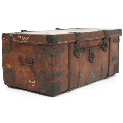 2026 - A LATE 19TH/EARLY 20TH CENTURY METAL BOUND LEATHER STAGECOACH TRUNK hinged top with suspension rings... 