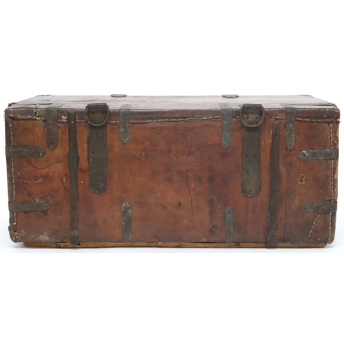 2026 - A LATE 19TH/EARLY 20TH CENTURY METAL BOUND LEATHER STAGECOACH TRUNK hinged top with suspension rings... 