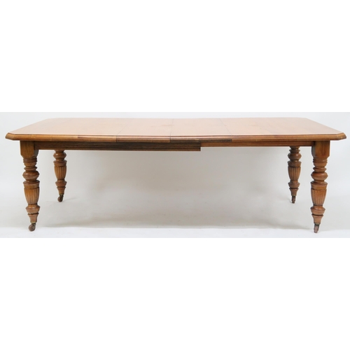 2049 - A VICTORIAN OAK ARTS & CRAFTS DINING SUITE consisting wind out dining table with two additional ... 
