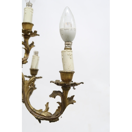 2051 - A CONTINENTAL ROCOCO STYLE GILT METAL CHANDELIER AND A PAIR OF WALL SCONCES chandelier with nine scr... 
