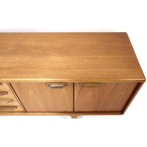 2101 - A MID 20TH CENTURY TEAK JOHN HERBERT FOR YOUNGER SIDEBOARD with four central drawer flanked by pairs... 