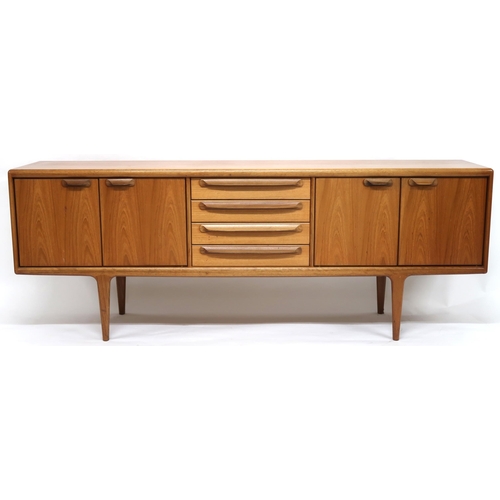 2101 - A MID 20TH CENTURY TEAK JOHN HERBERT FOR YOUNGER SIDEBOARD with four central drawer flanked by pairs... 