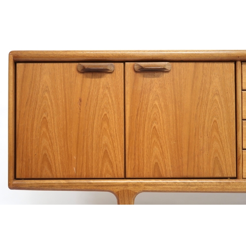 2101 - A MID 20TH CENTURY TEAK JOHN HERBERT FOR YOUNGER SIDEBOARD with four central drawer flanked by pairs... 