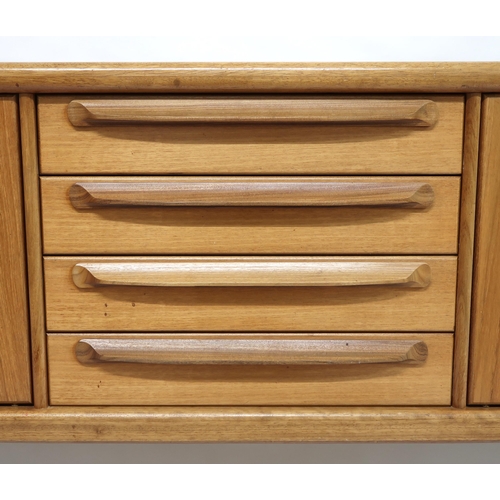 2101 - A MID 20TH CENTURY TEAK JOHN HERBERT FOR YOUNGER SIDEBOARD with four central drawer flanked by pairs... 