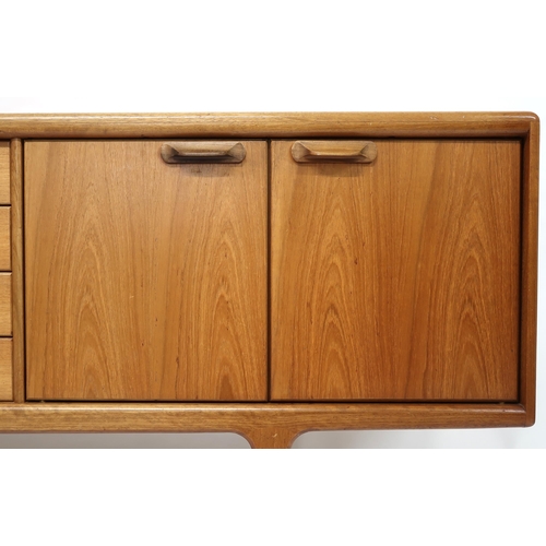 2101 - A MID 20TH CENTURY TEAK JOHN HERBERT FOR YOUNGER SIDEBOARD with four central drawer flanked by pairs... 