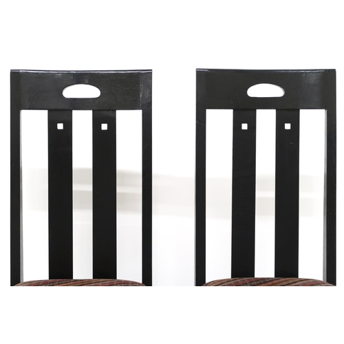 2114 - A PAIR OF 20TH CENTURY AFTER CHARLES RENNIE MACKINTOSH EBONISED CHAIRS with pierced slatted backs ov... 