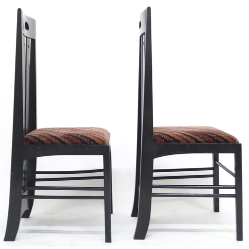 2114 - A PAIR OF 20TH CENTURY AFTER CHARLES RENNIE MACKINTOSH EBONISED CHAIRS with pierced slatted backs ov... 