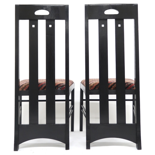 2114 - A PAIR OF 20TH CENTURY AFTER CHARLES RENNIE MACKINTOSH EBONISED CHAIRS with pierced slatted backs ov... 