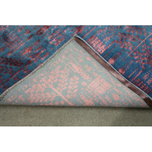 2131 - A BLUE GROUND SHIRAZ RUG with all-over mottled pink foliate patterned ground, 229cm long x 167cm wid... 