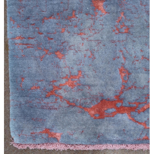 2135 - A PINK AND MAUVE GROUND SHIRAZ RUG with mottled patterned ground, 193cm long x 152cm wide... 