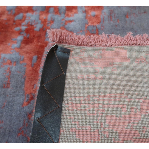 2135 - A PINK AND MAUVE GROUND SHIRAZ RUG with mottled patterned ground, 193cm long x 152cm wide... 