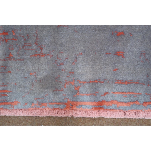 2135 - A PINK AND MAUVE GROUND SHIRAZ RUG with mottled patterned ground, 193cm long x 152cm wide... 