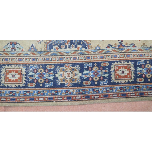 2140 - A LARGE BEIGE GROUND JAMES TEMPLETON & CO LTD STYLE RUG with all-over multicoloured lozenge desi... 