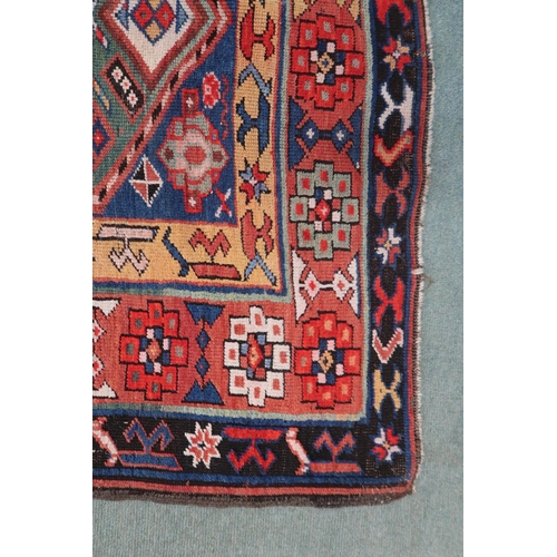 2143 - A DARK BLUE GROUND CAUCASIAN RUNNER with four multicoloured diamond medallions and multicoloure... 