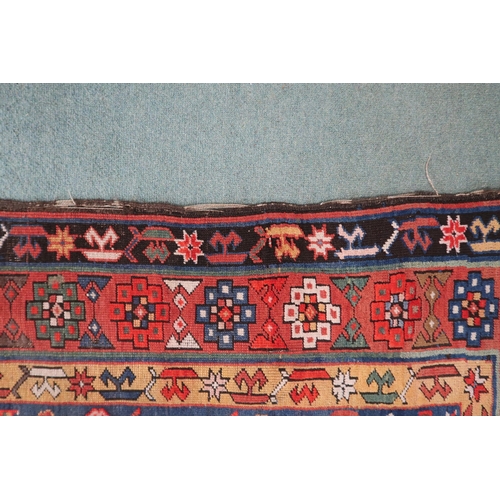 2143 - A DARK BLUE GROUND CAUCASIAN RUNNER with four multicoloured diamond medallions and multicoloure... 