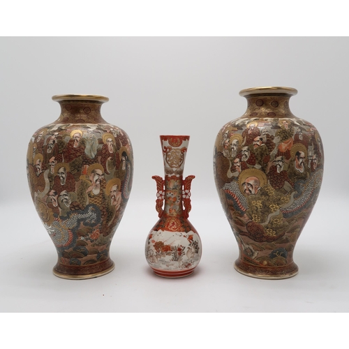 2302 - A PAIR OF SATSUMA BALUSTER VASES Painted with Kannon and immortal figures amongst a dragon and withi... 