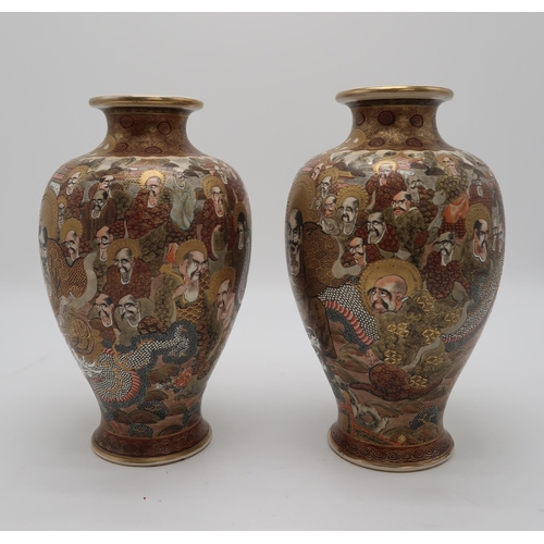 2302 - A PAIR OF SATSUMA BALUSTER VASES Painted with Kannon and immortal figures amongst a dragon and withi... 