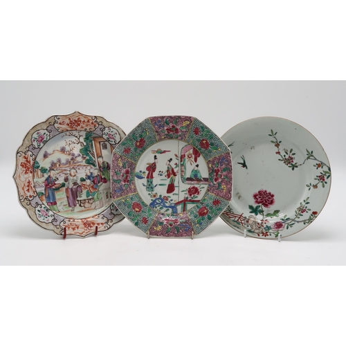 2304 - A CHINESE FAMILLE ROSE EXPORT OCTAGONAL PLATE Painted with three figures within elaborate foliate bo... 