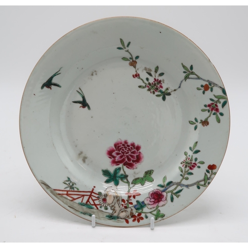 2304 - A CHINESE FAMILLE ROSE EXPORT OCTAGONAL PLATE Painted with three figures within elaborate foliate bo... 