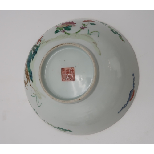 2314 - A CHINESE FAMILLE ROSE BOWLpainted with deer and crane amongst trees and rockery, red seal mark, 18.... 