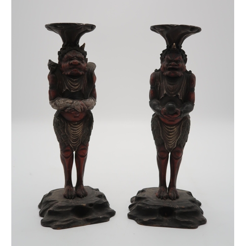 2316 - A PAIR OF CARVED WOOD,POLYCHROME AND GESSO ONI CANDLESTICKS each demon standing and facing forwards,... 