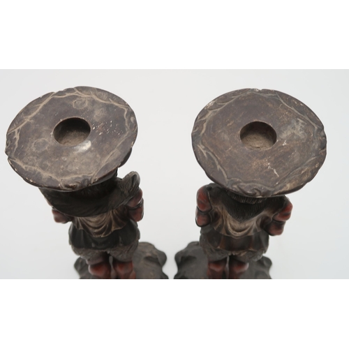 2316 - A PAIR OF CARVED WOOD,POLYCHROME AND GESSO ONI CANDLESTICKS each demon standing and facing forwards,... 