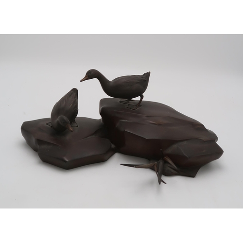 2321 - A JAPANESE BRONZE MODEL OF TWO DUCKSstanding on rockwork, 17cm high and 39cm wide... 