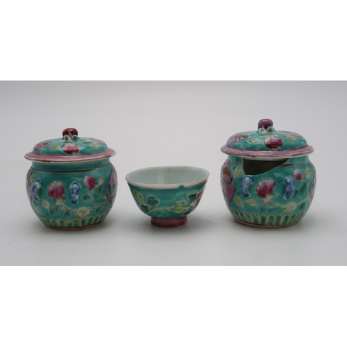 2324 - TWO CHINESE MINIATURE JARS AND COVERS each painted with birds and flowers,with peach finials, 6.5cm ... 