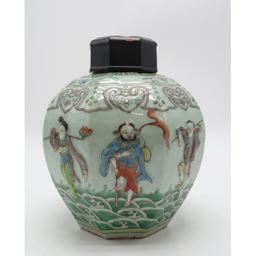 2325 - A CHINESE CELADON GROUND OCTAGONAL JAR AND COVER moulded in relief with figures on waves and beneath... 