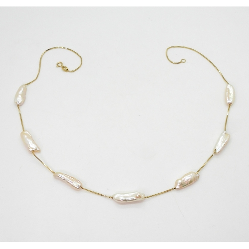2701 - AN 18K GOLD PEARL NECKLACEfrom the Jewellery Channels premier Brand Illiana, an 18k gold box chain s... 