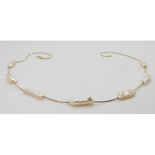 2701 - AN 18K GOLD PEARL NECKLACEfrom the Jewellery Channels premier Brand Illiana, an 18k gold box chain s... 