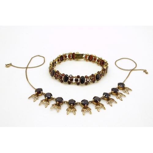 2705 - GARNET JEWELSa 14kt garnet set bracelet, length 19cm, weight 21.1gms, together with a leaf pattern n... 