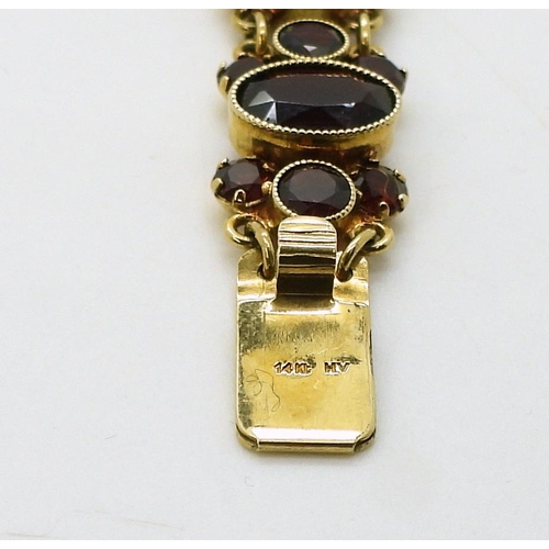 2705 - GARNET JEWELSa 14kt garnet set bracelet, length 19cm, weight 21.1gms, together with a leaf pattern n... 