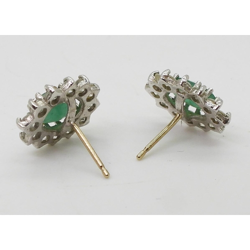 2706 - EMERALD & DIAMOND RING & EARRINGS.the 18ct gold ring, is set with estimated approx 0.35cts o... 