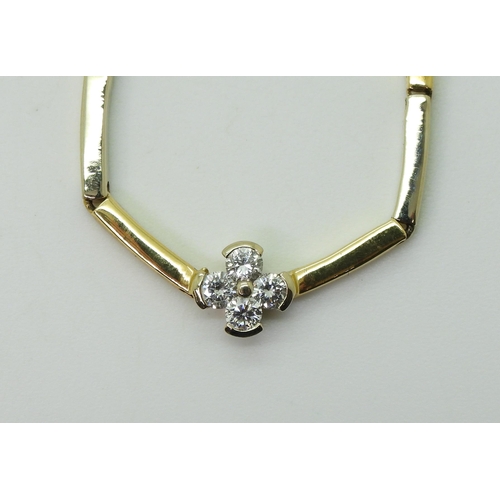 2714 - A DIAMOND FLOWER NECKLACEthe baton links of yellow and white metal have a four petaled flower in the... 