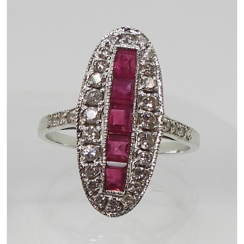 2715 - A RUBY AND DIAMOND PANEL RINGmounted in 18ct white gold, finger size N, weight 3.9gms... 