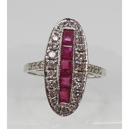 2715 - A RUBY AND DIAMOND PANEL RINGmounted in 18ct white gold, finger size N, weight 3.9gms... 