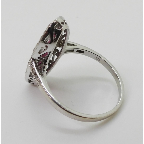 2715 - A RUBY AND DIAMOND PANEL RINGmounted in 18ct white gold, finger size N, weight 3.9gms... 