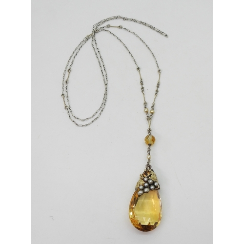 2722 - A CITRINE VINE PENDANTProbably made by DORRIE NOSSITER. With a grape and vine theme, the yellow meta... 