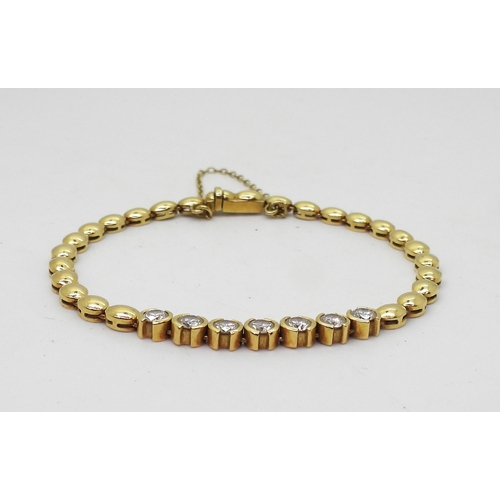 2724 - A DIAMOND BRACELETthe clasp stamped 750 18ct gold, with seven round brilliant cut diamonds with an e... 
