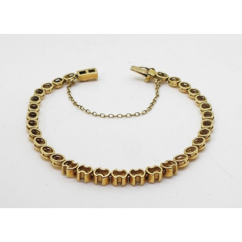 2724 - A DIAMOND BRACELETthe clasp stamped 750 18ct gold, with seven round brilliant cut diamonds with an e... 