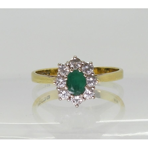 2726 - AN EMERALD & DIAMOND SUITEcomprising of a 18ct gold ring, size P1/2, set with a central emerald ... 