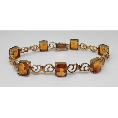 2730 - A CITRINE BRACELETmounted in 9ct gold with pretty scroll shaped links, each citrine is approx 10mm x... 