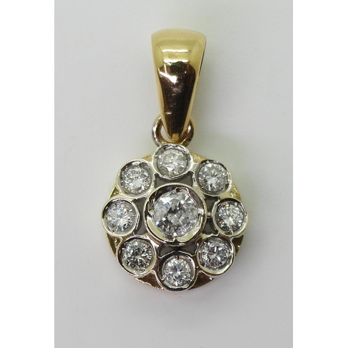 2731 - A DIAMOND FLOWER PENDANTmounted in 18ct gold and set with estimated approx 0.60cts of brilliant cut ... 