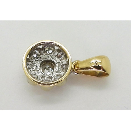 2731 - A DIAMOND FLOWER PENDANTmounted in 18ct gold and set with estimated approx 0.60cts of brilliant cut ... 