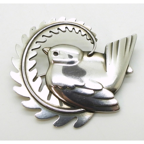 2734 - A GEORG JENSEN BROOCHnumber 309, designed by Arno Malinowski bird with a fern. Fully stamped with Ge... 