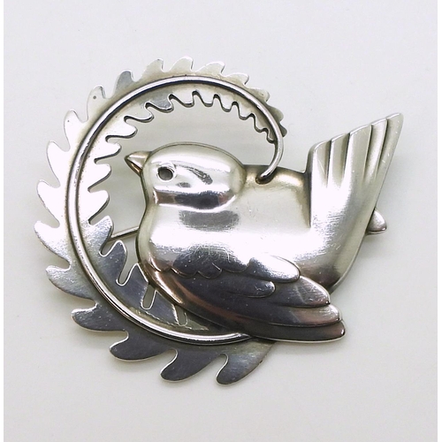 2734 - A GEORG JENSEN BROOCHnumber 309, designed by Arno Malinowski bird with a fern. Fully stamped with Ge... 