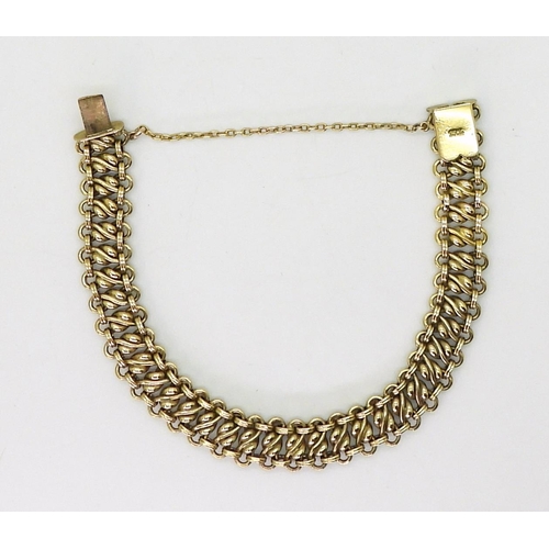 2745 - A 15CT GOLD BRACELETwith fancy twist pattern links with box clasp fastening. 19.5cm long, weight 19.... 