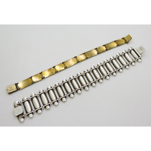 2747 - TWO SCANDINAVIAN BRACELETSa silver white enamelled modernist design cuff bracelet, designed by Einar... 